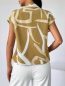 Blusa elegante con lazo al cuello y mangas murciélago